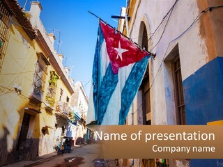 A Flag Hanging From A Building On A Street PowerPoint Template