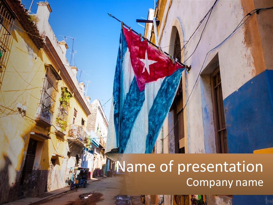 A Flag Hanging From A Building On A Street PowerPoint Template