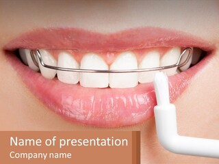 A Woman Is Brushing Her Teeth With A Toothbrush PowerPoint Template