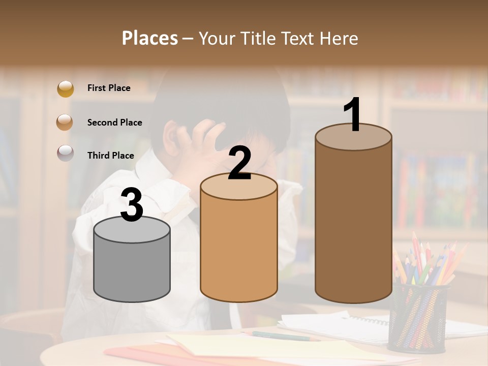 A Young Boy Sitting At A Desk In Front Of A Book Shelf PowerPoint Template