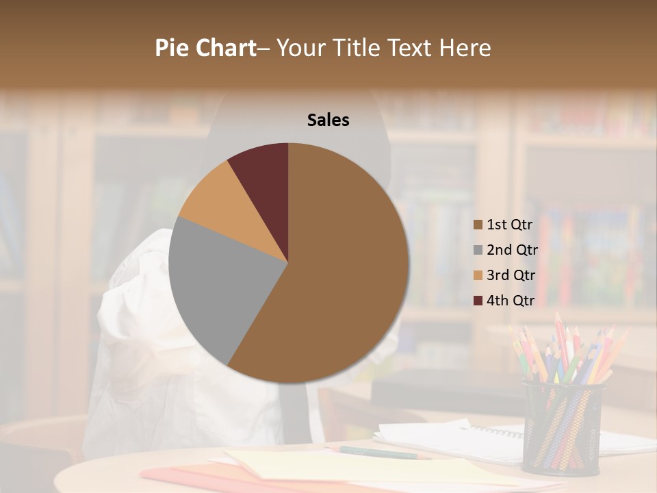 A Young Boy Sitting At A Desk In Front Of A Book Shelf PowerPoint Template