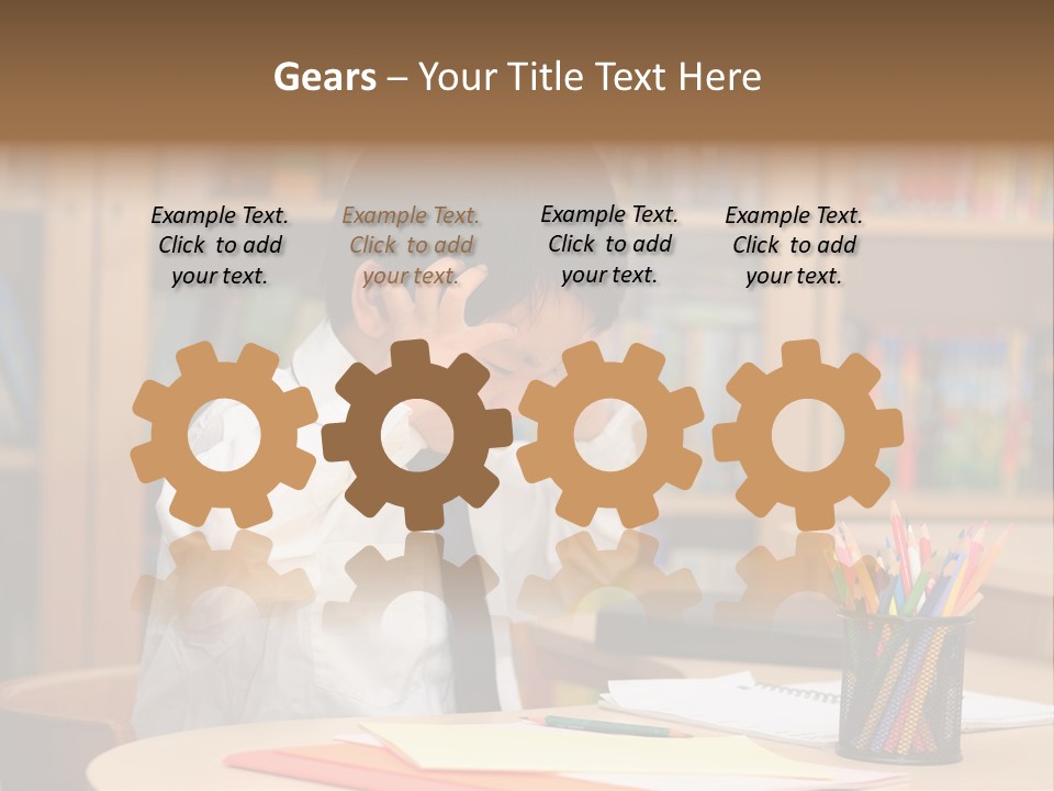 A Young Boy Sitting At A Desk In Front Of A Book Shelf PowerPoint Template