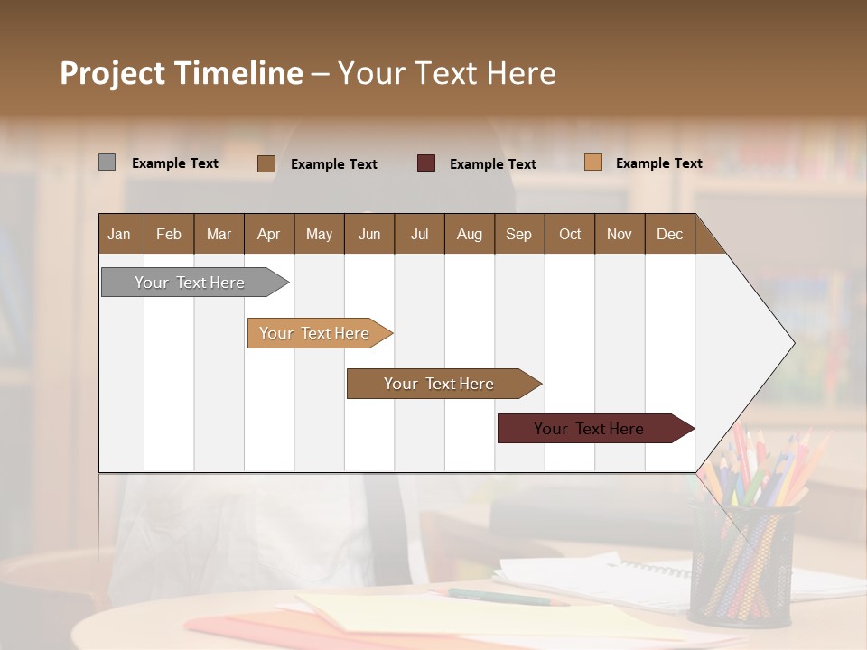 A Young Boy Sitting At A Desk In Front Of A Book Shelf PowerPoint Template