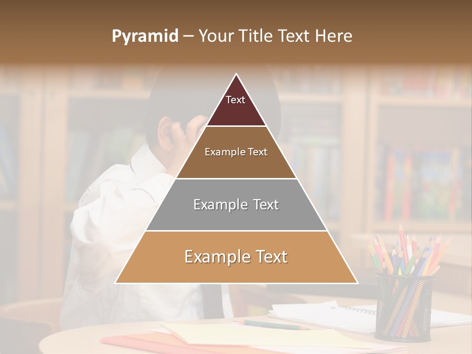 A Young Boy Sitting At A Desk In Front Of A Book Shelf PowerPoint Template