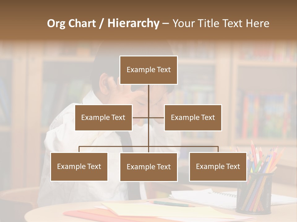 A Young Boy Sitting At A Desk In Front Of A Book Shelf PowerPoint Template