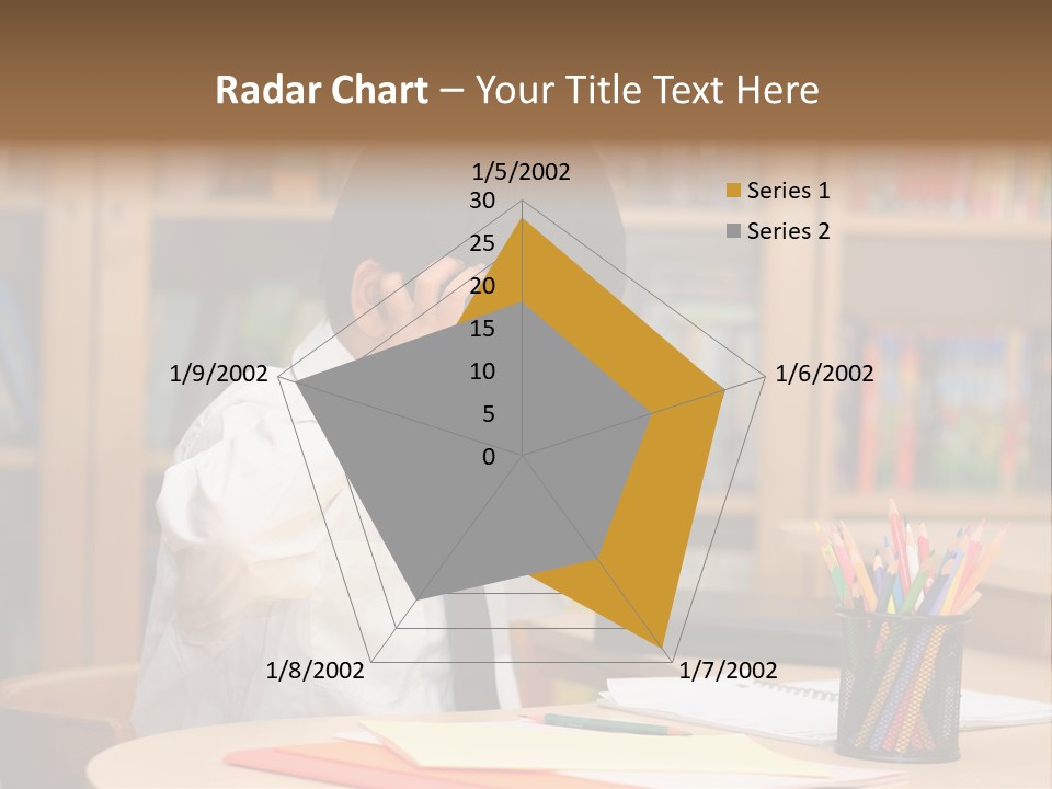 A Young Boy Sitting At A Desk In Front Of A Book Shelf PowerPoint Template