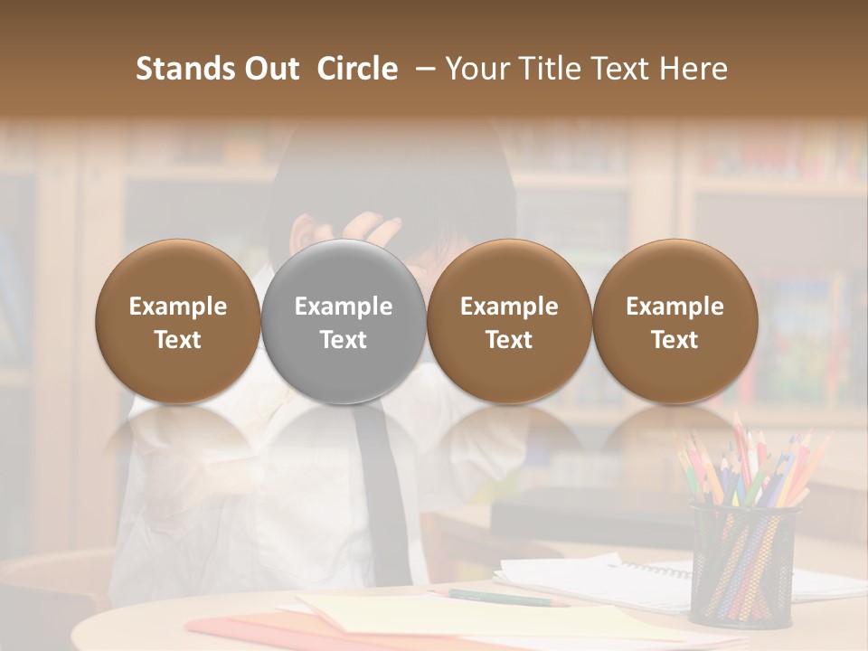 A Young Boy Sitting At A Desk In Front Of A Book Shelf PowerPoint Template