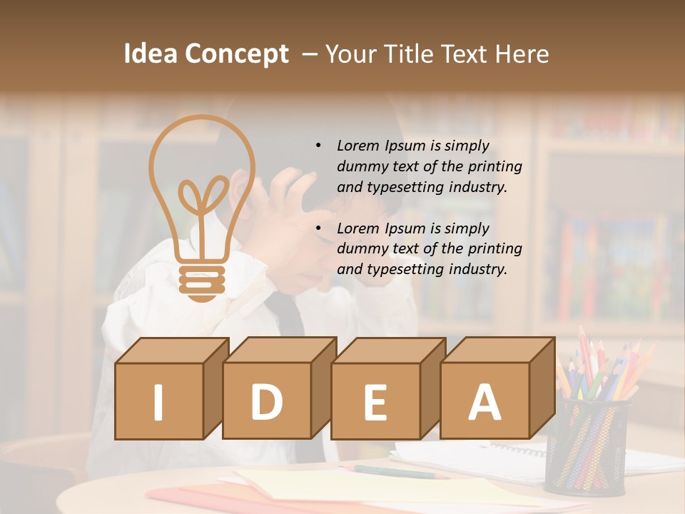 A Young Boy Sitting At A Desk In Front Of A Book Shelf PowerPoint Template