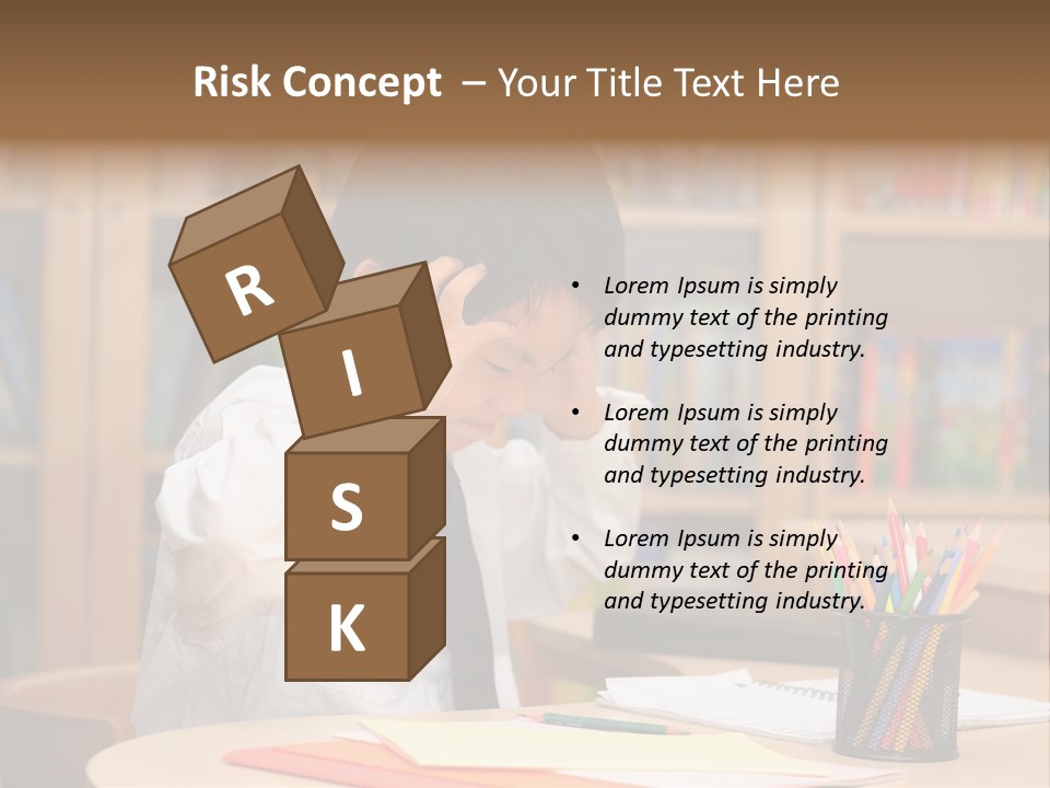 A Young Boy Sitting At A Desk In Front Of A Book Shelf PowerPoint Template