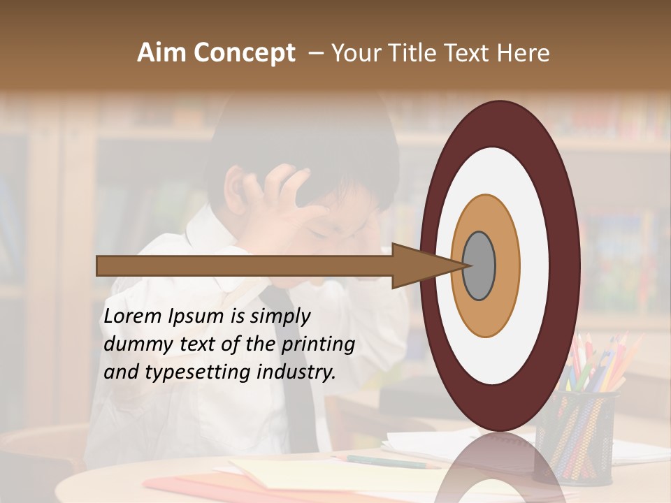 A Young Boy Sitting At A Desk In Front Of A Book Shelf PowerPoint Template