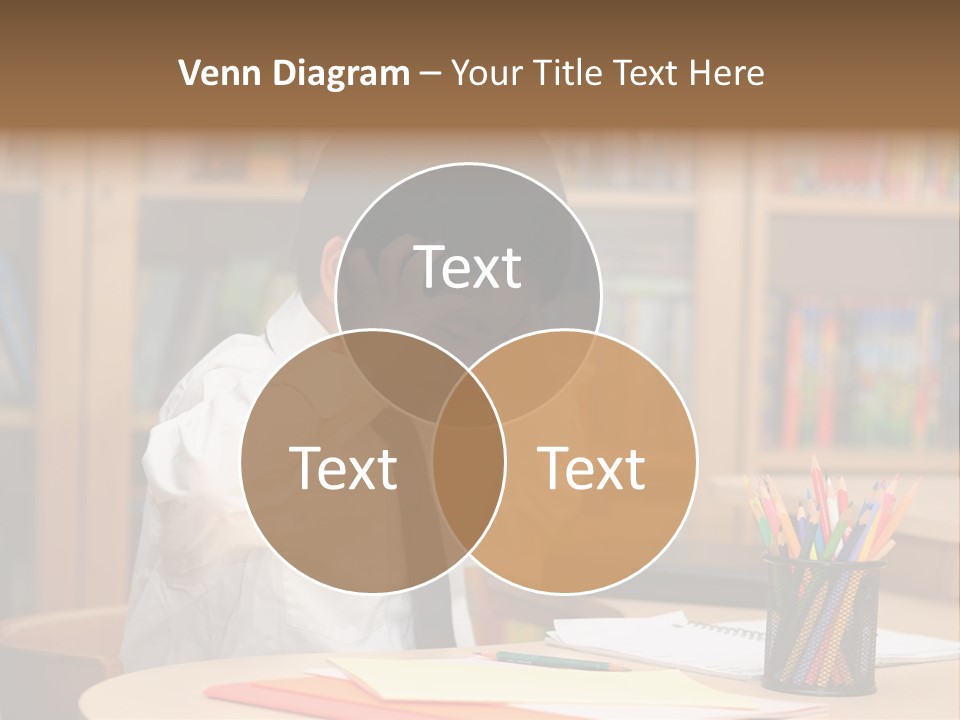 A Young Boy Sitting At A Desk In Front Of A Book Shelf PowerPoint Template