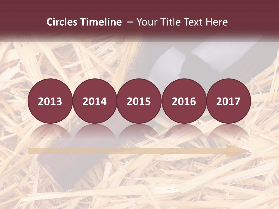 A Bottle Of Wine Sitting On Top Of Straw PowerPoint Template