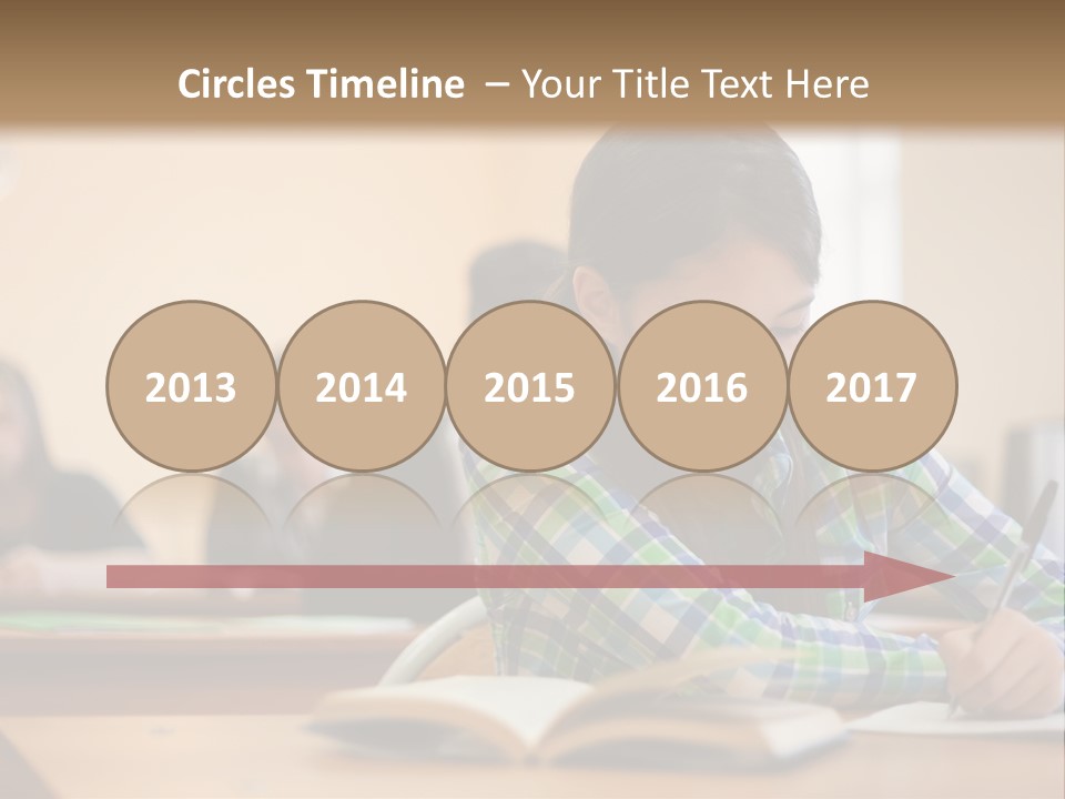 A Young Girl Sitting At A Desk With A Book In Front Of Her PowerPoint Template