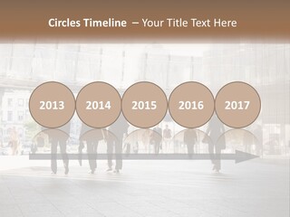 A Group Of People Walking Down A Street PowerPoint Template