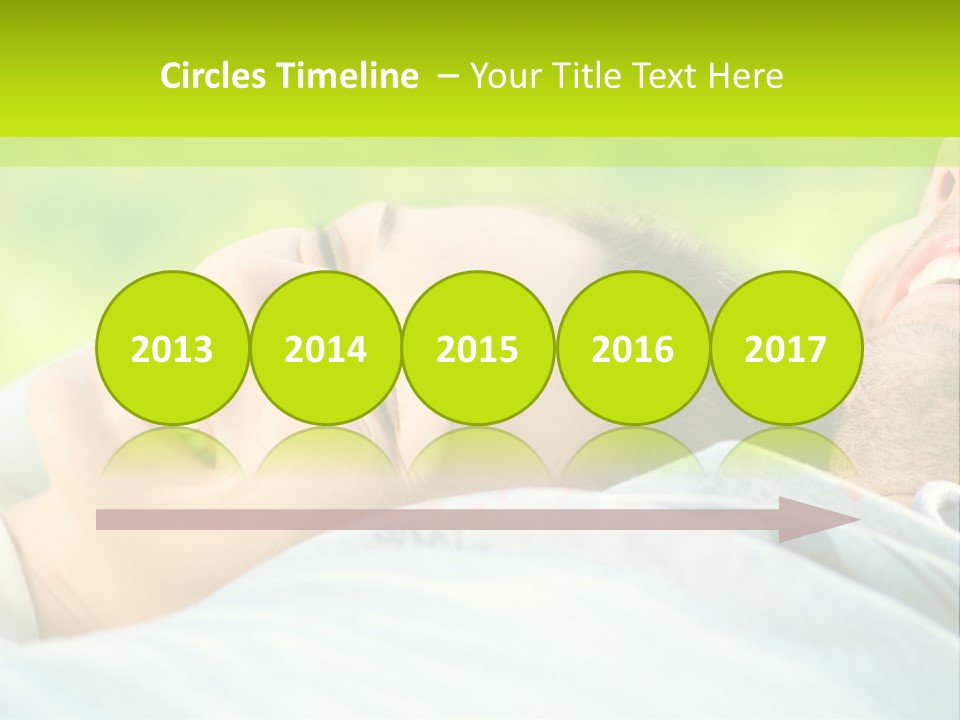 A Man And A Woman Laying On The Grass PowerPoint Template