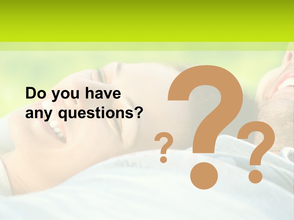 A Man And A Woman Laying On The Grass PowerPoint Template