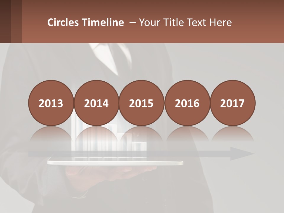 A Man In A Suit Holding A Tablet With A Chart On It PowerPoint Template