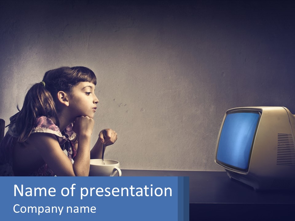 A Little Girl Sitting In Front Of A Computer PowerPoint Template