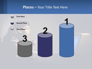 A Little Girl Sitting In Front Of A Computer PowerPoint Template