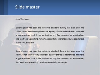 A Little Girl Sitting In Front Of A Computer PowerPoint Template