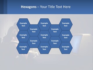 A Little Girl Sitting In Front Of A Computer PowerPoint Template