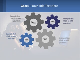 A Little Girl Sitting In Front Of A Computer PowerPoint Template