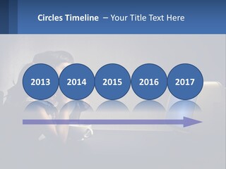 A Little Girl Sitting In Front Of A Computer PowerPoint Template