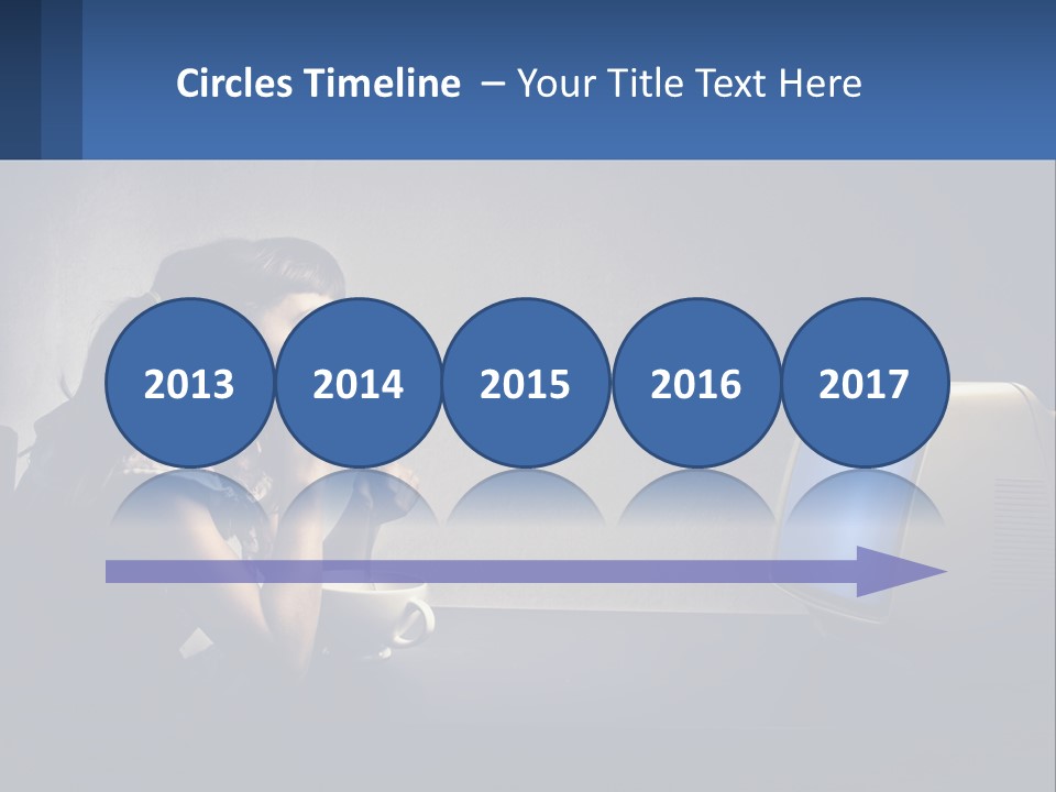 A Little Girl Sitting In Front Of A Computer PowerPoint Template