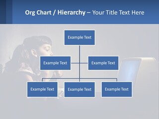 A Little Girl Sitting In Front Of A Computer PowerPoint Template