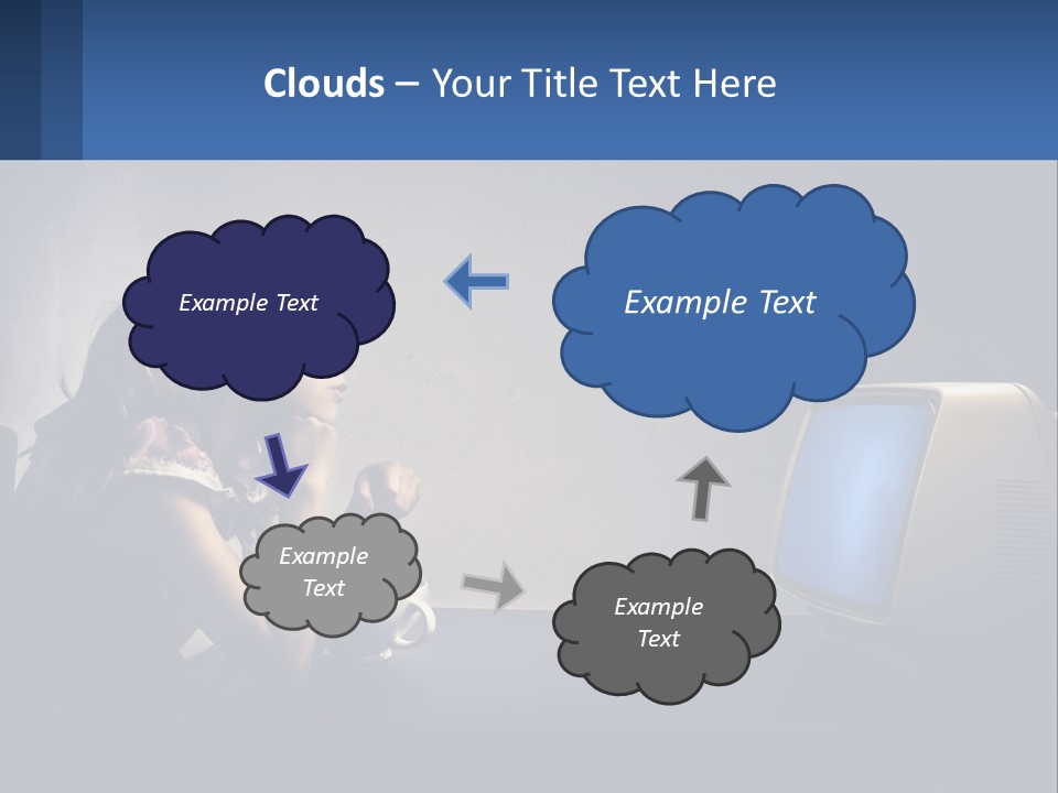A Little Girl Sitting In Front Of A Computer PowerPoint Template