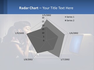 A Little Girl Sitting In Front Of A Computer PowerPoint Template