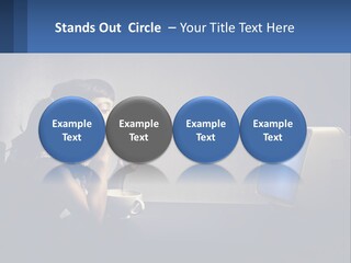 A Little Girl Sitting In Front Of A Computer PowerPoint Template