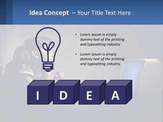 A Little Girl Sitting In Front Of A Computer PowerPoint Template