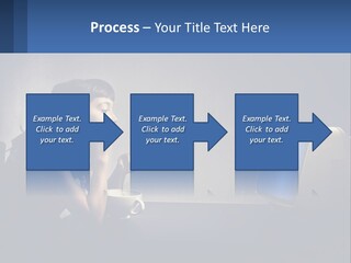 A Little Girl Sitting In Front Of A Computer PowerPoint Template