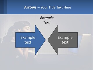 A Little Girl Sitting In Front Of A Computer PowerPoint Template