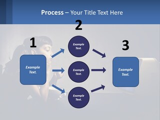 A Little Girl Sitting In Front Of A Computer PowerPoint Template