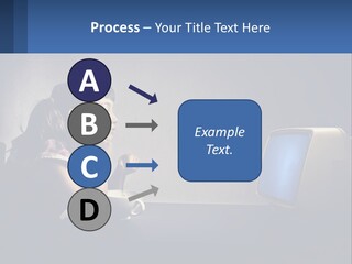 A Little Girl Sitting In Front Of A Computer PowerPoint Template