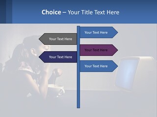 A Little Girl Sitting In Front Of A Computer PowerPoint Template