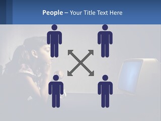 A Little Girl Sitting In Front Of A Computer PowerPoint Template