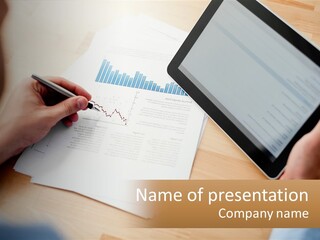 A Person Writing On A Piece Of Paper Next To A Tablet PowerPoint Template