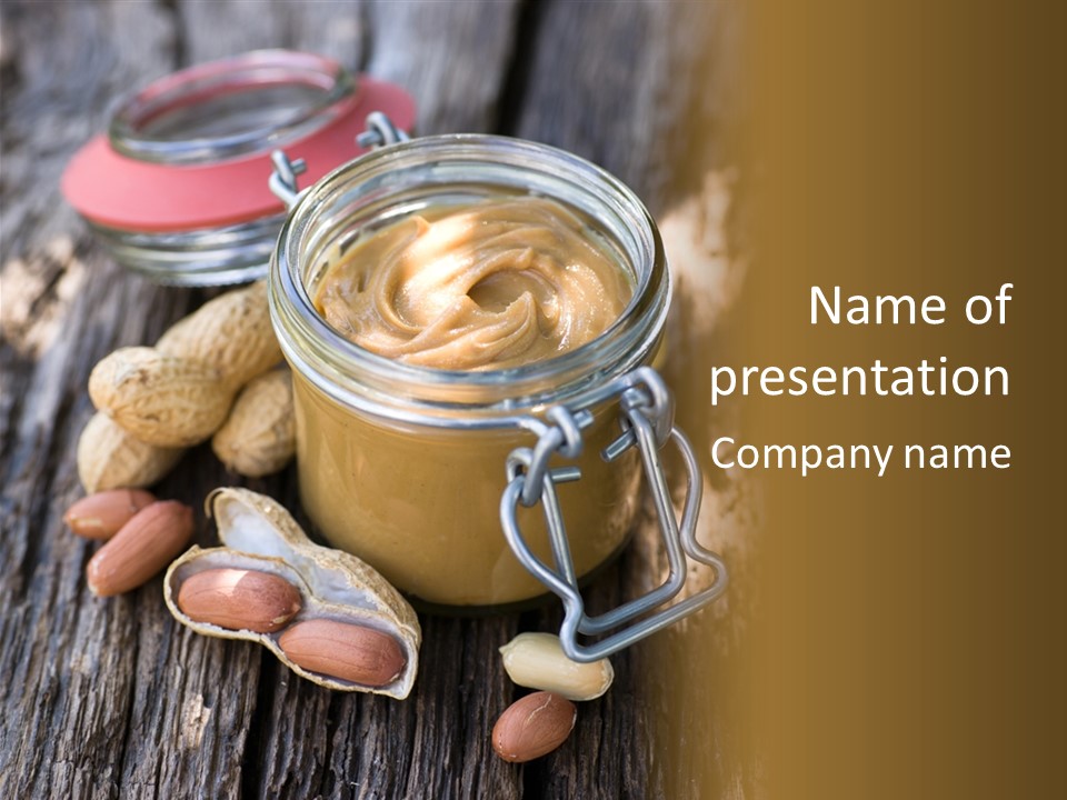 A Jar Of Peanut Butter And Peanuts On A Wooden Table PowerPoint Template