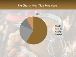 A Jar Of Peanut Butter And Peanuts On A Wooden Table PowerPoint Template