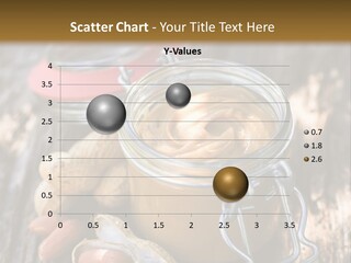 A Jar Of Peanut Butter And Peanuts On A Wooden Table PowerPoint Template