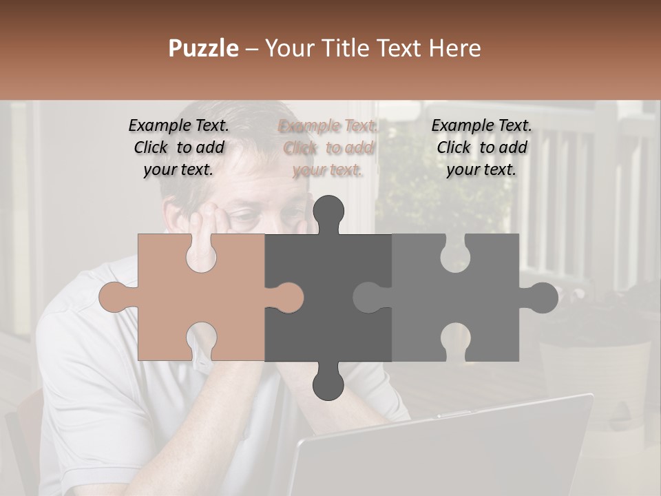 A Man Sitting At A Table With A Laptop In Front Of Him PowerPoint Template