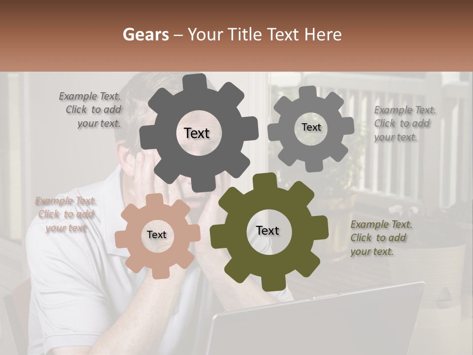 A Man Sitting At A Table With A Laptop In Front Of Him PowerPoint Template