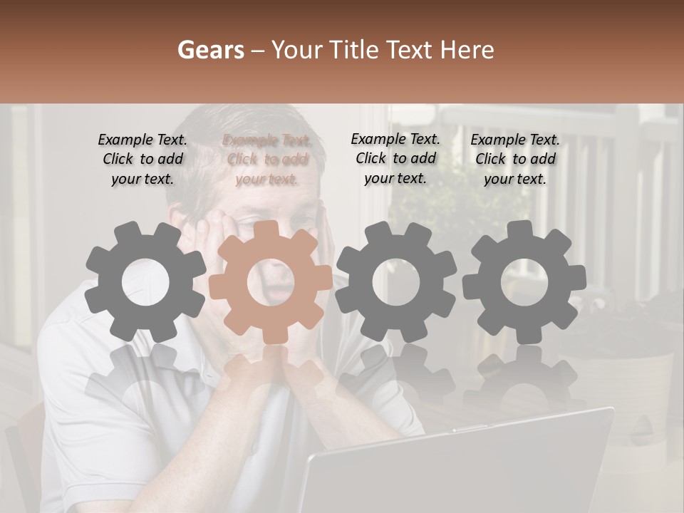 A Man Sitting At A Table With A Laptop In Front Of Him PowerPoint Template