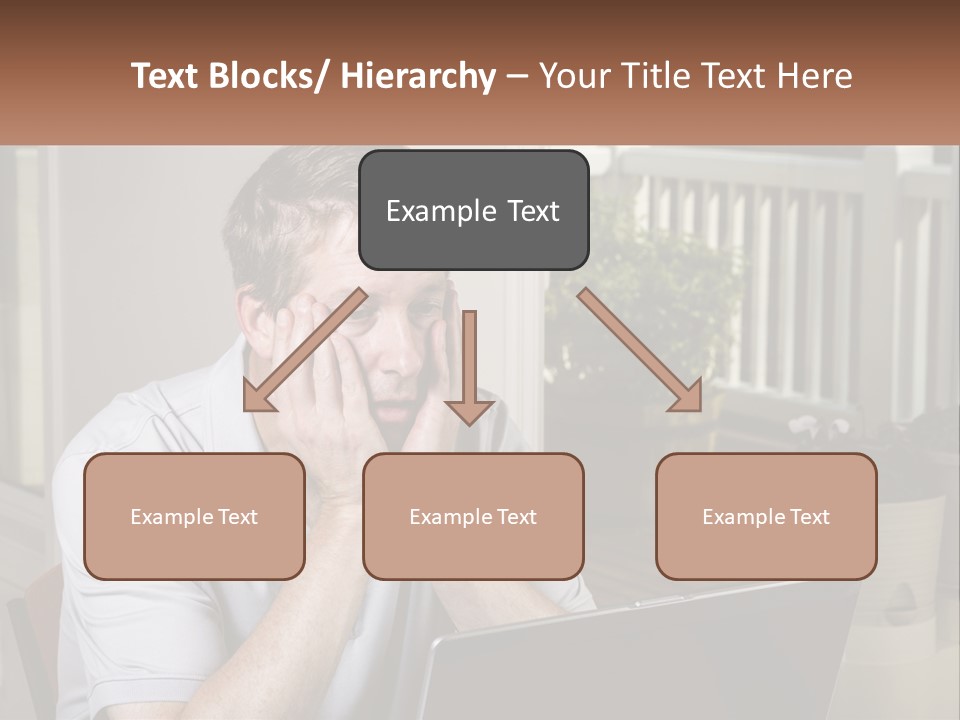 A Man Sitting At A Table With A Laptop In Front Of Him PowerPoint Template