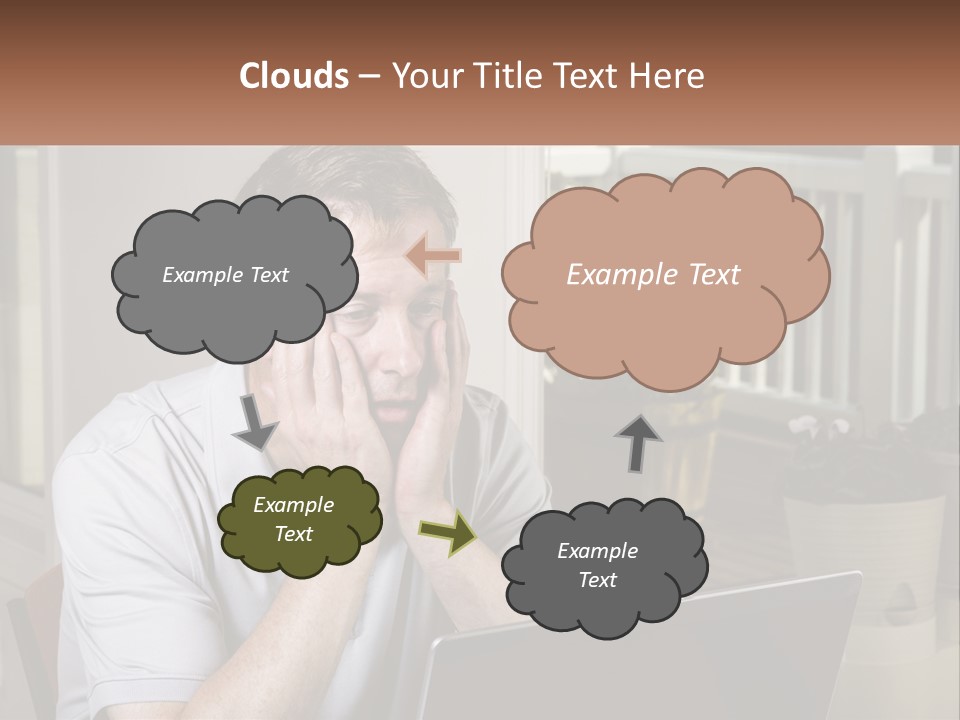A Man Sitting At A Table With A Laptop In Front Of Him PowerPoint Template