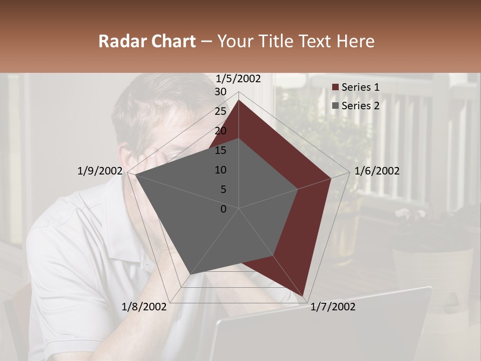 A Man Sitting At A Table With A Laptop In Front Of Him PowerPoint Template
