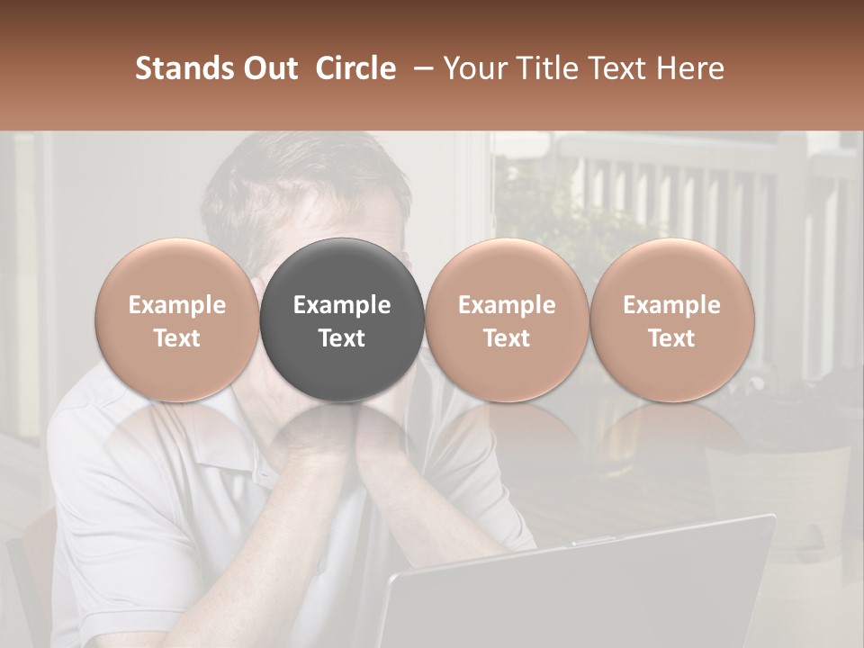 A Man Sitting At A Table With A Laptop In Front Of Him PowerPoint Template